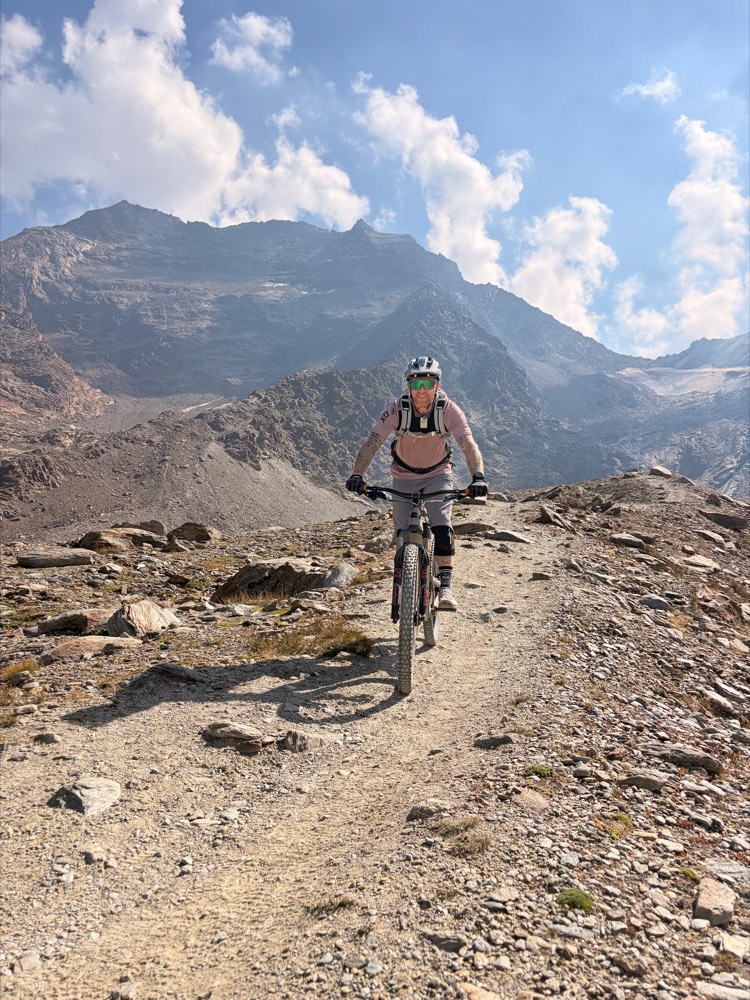 Mike Hinnen on a mountain bike on a high alpine trail